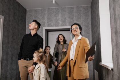 family looking at new home with realtor